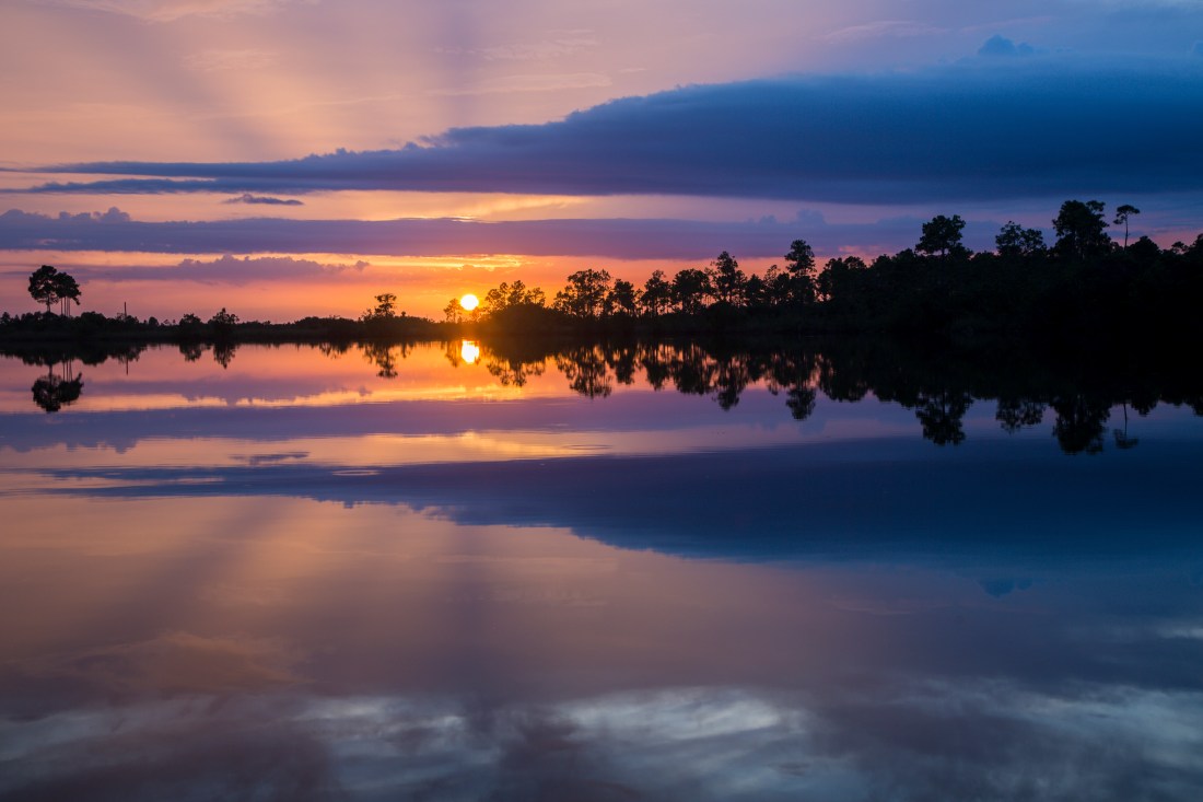 Sunset reflections, Pines Glades Lake. Everglades National Park, Florida, USA.