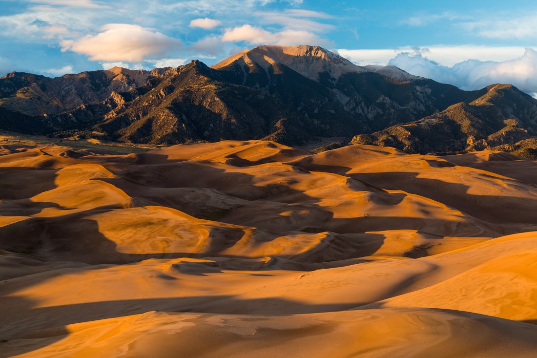 Distant view of the dune field and Sangre de Christo mountains at sunset. Great Sand Dunes National Park, Colorado (QT Tuan)